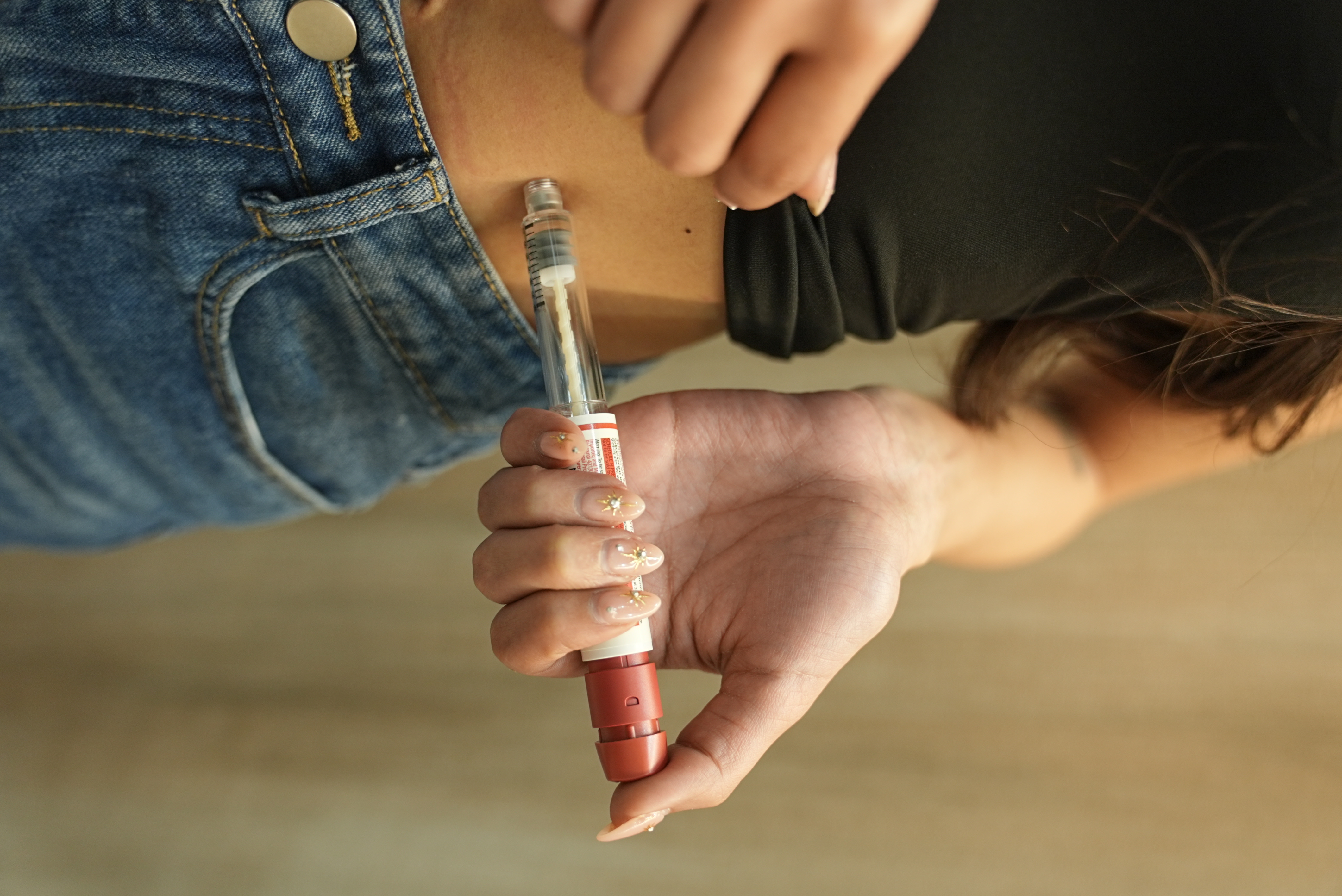 A photograph of a hormone injection pen used for ovarian stimulation during the egg freezing process.